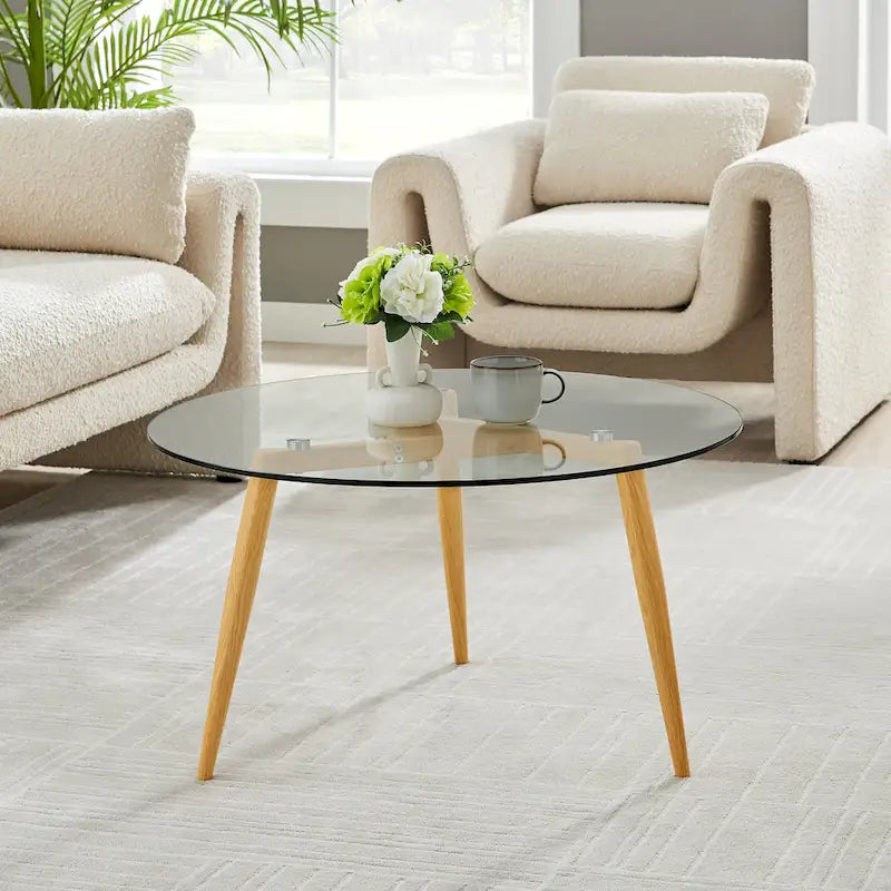 Table basse avec pieds effilés et plateau en verre